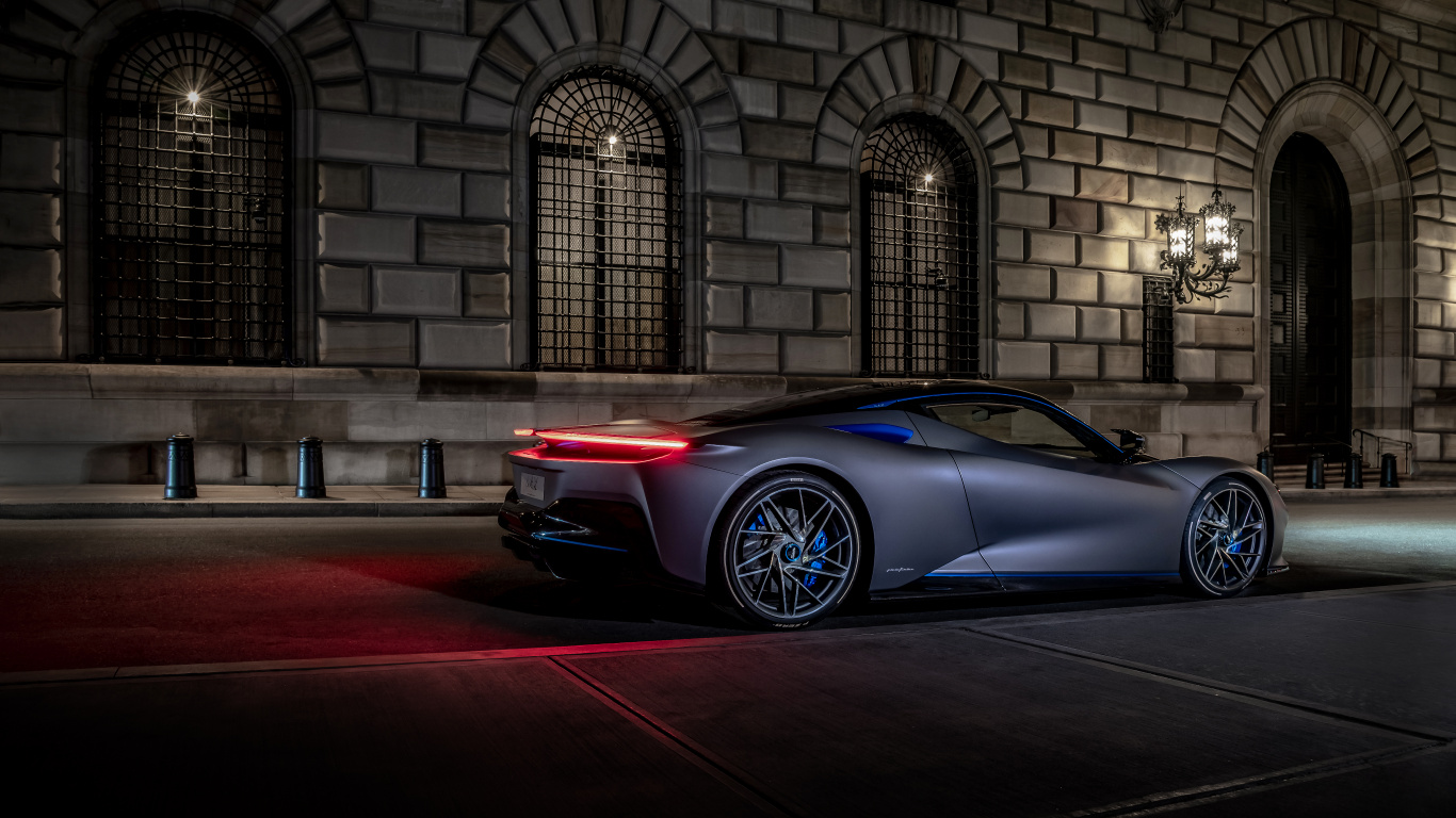 Blue Porsche 911 Parked in Front of Building. Wallpaper in 1366x768 Resolution