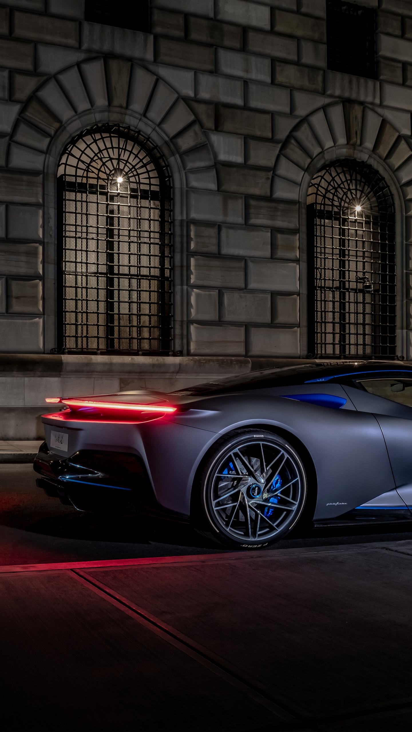 Blue Porsche 911 Parked in Front of Building. Wallpaper in 1440x2560 Resolution