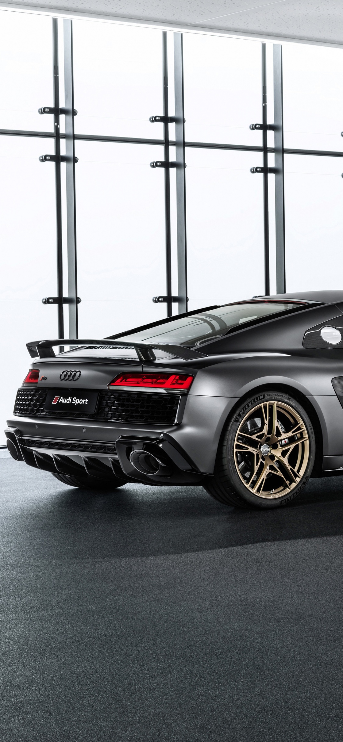 Black Porsche 911 Parked in a Room. Wallpaper in 1125x2436 Resolution