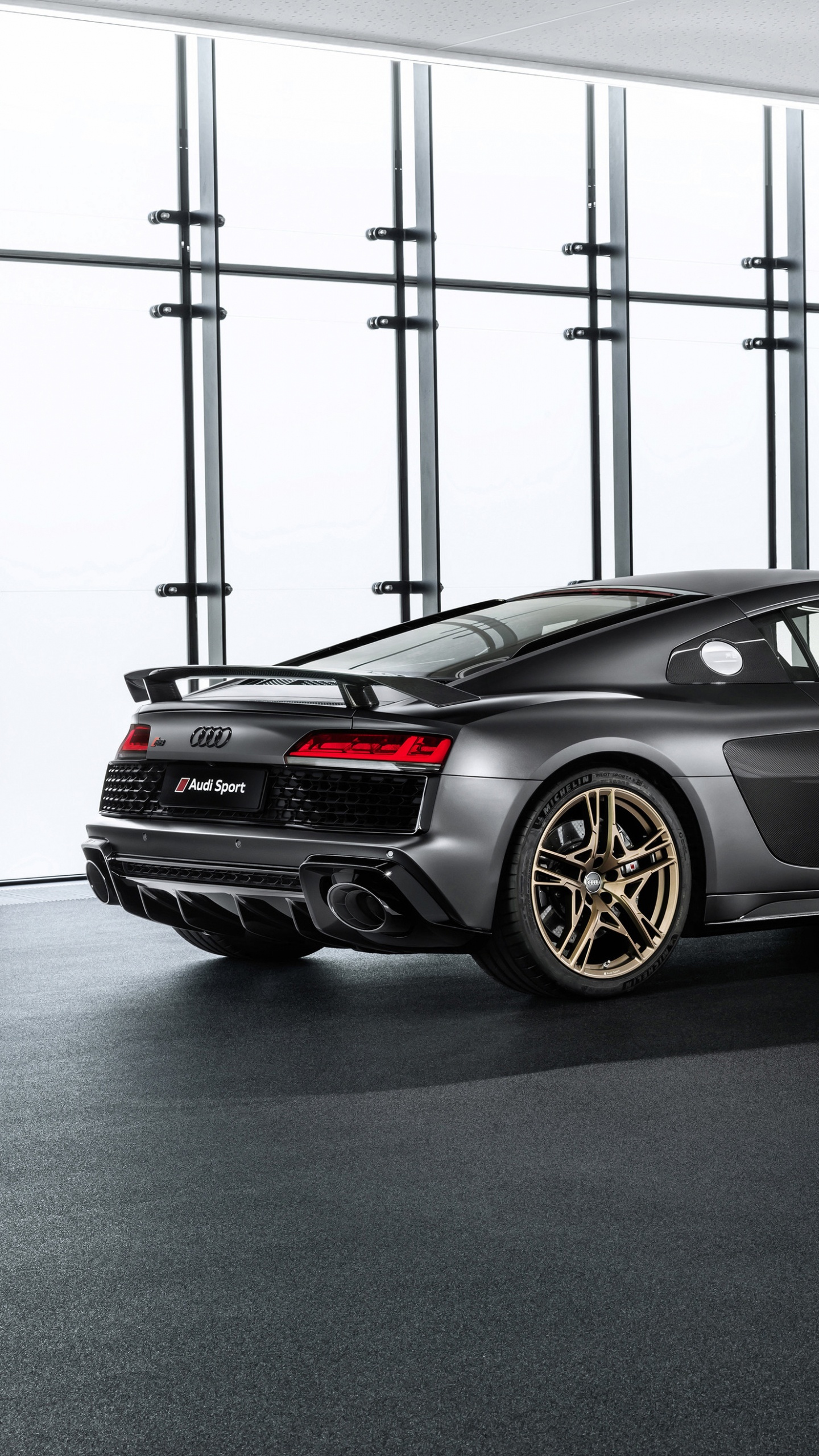 Black Porsche 911 Parked in a Room. Wallpaper in 1440x2560 Resolution