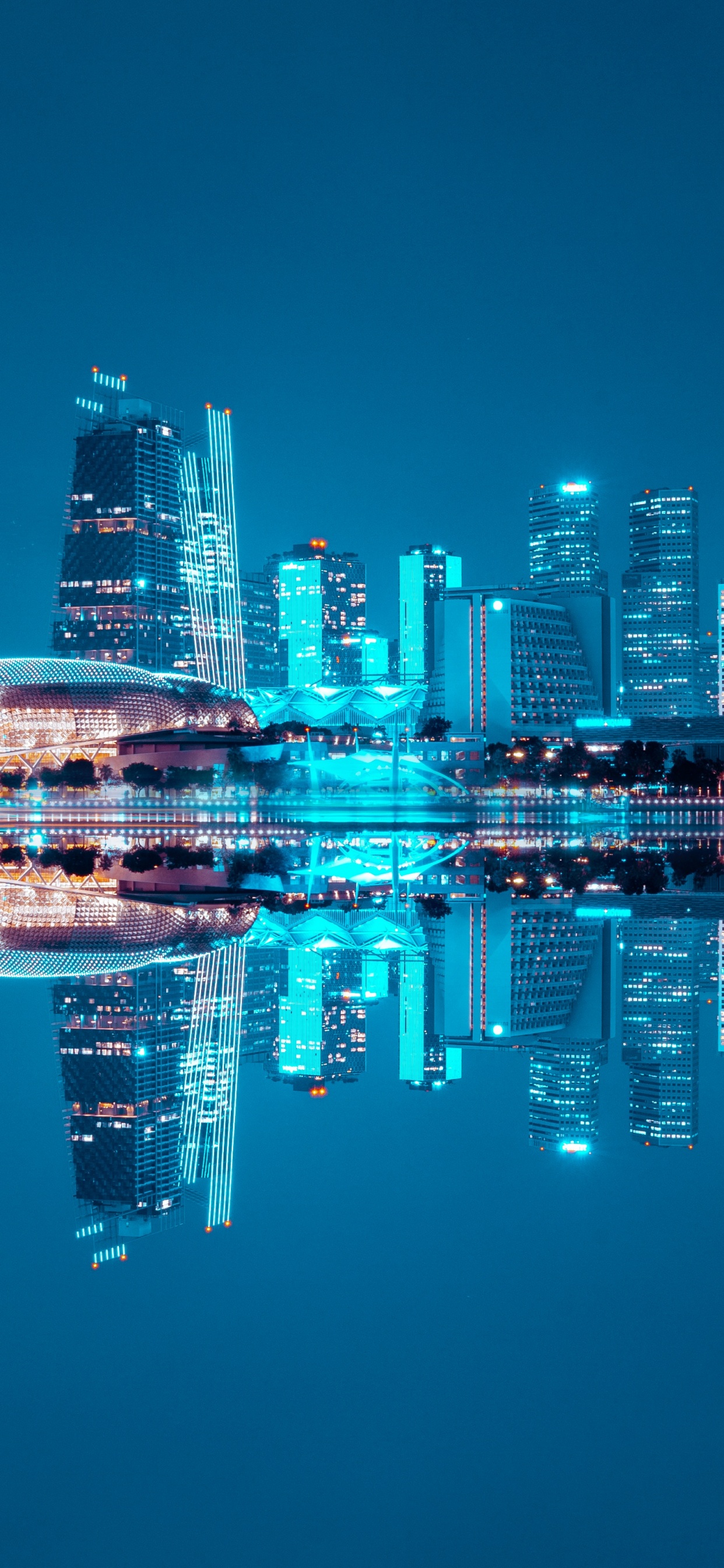 City Skyline Across Body of Water During Night Time. Wallpaper in 1242x2688 Resolution