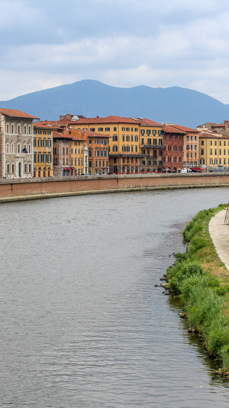 Brown Concrete Building Beside River During Daytime. Wallpaper in 750x1334 Resolution