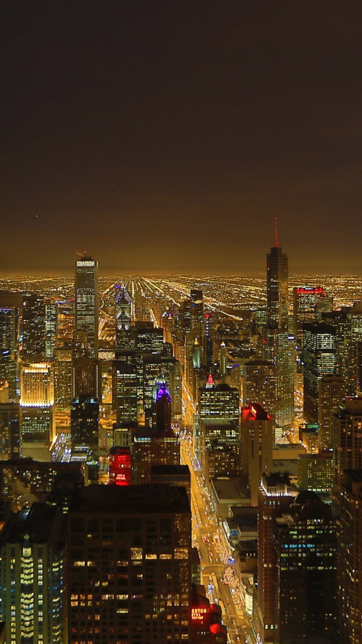 City With High Rise Buildings During Night Time. Wallpaper in 720x1280 Resolution