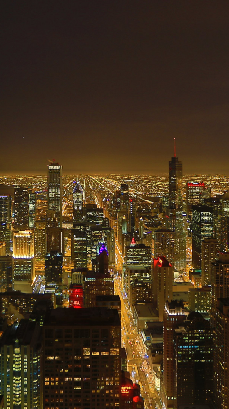 City With High Rise Buildings During Night Time. Wallpaper in 750x1334 Resolution