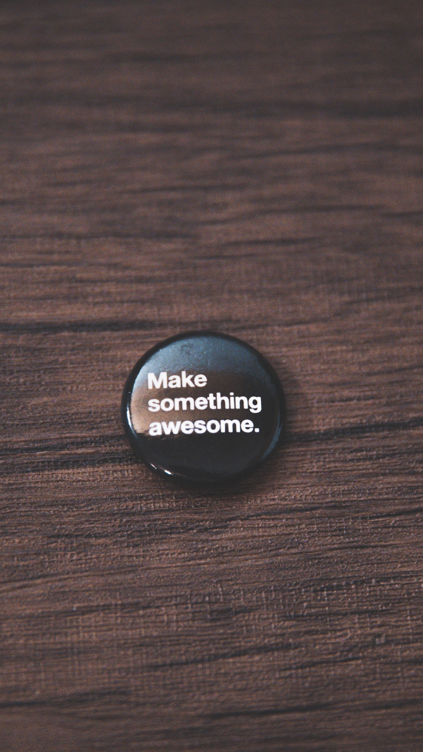 Black Round Plastic Lid on Brown Wooden Table. Wallpaper in 1440x2560 Resolution