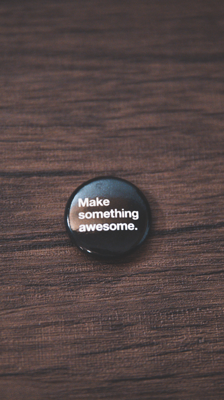 Black Round Plastic Lid on Brown Wooden Table. Wallpaper in 750x1334 Resolution