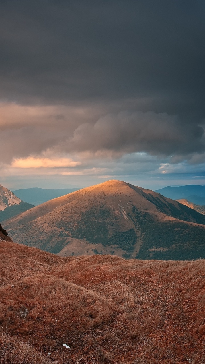 Brown and Green Mountains Under White Clouds and Blue Sky During Daytime. Wallpaper in 720x1280 Resolution