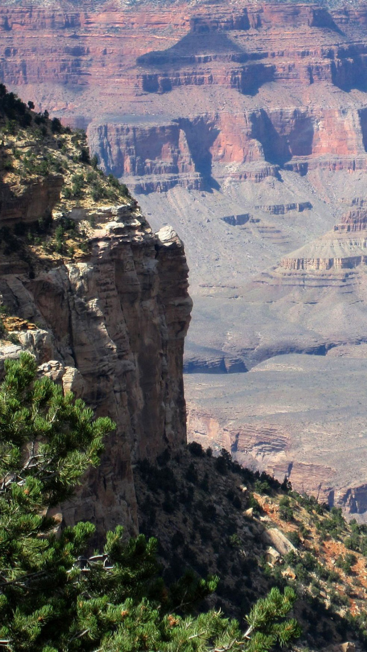 Brown Rocky Mountain During Daytime. Wallpaper in 750x1334 Resolution