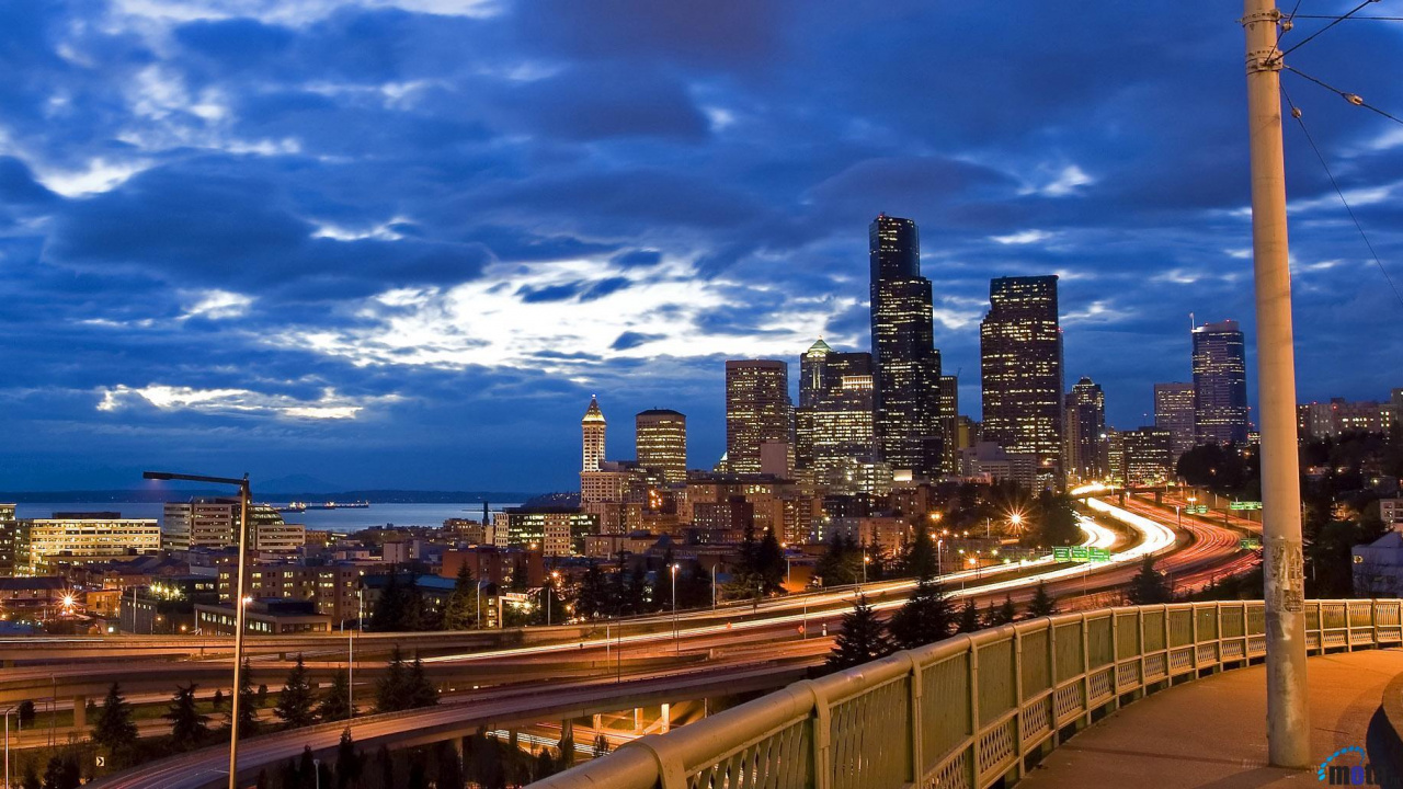 City Buildings Under Blue Sky During Night Time. Wallpaper in 1280x720 Resolution