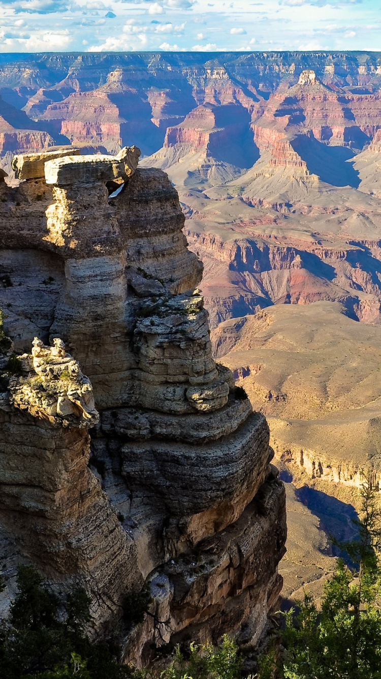 Brown Rocky Mountain During Daytime. Wallpaper in 750x1334 Resolution