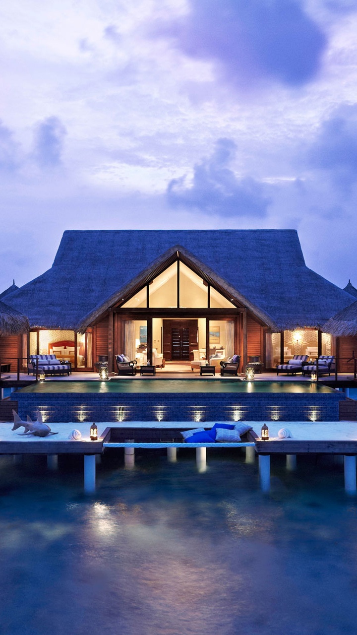 Brown Wooden Houses on Water Under Blue Sky During Daytime. Wallpaper in 720x1280 Resolution