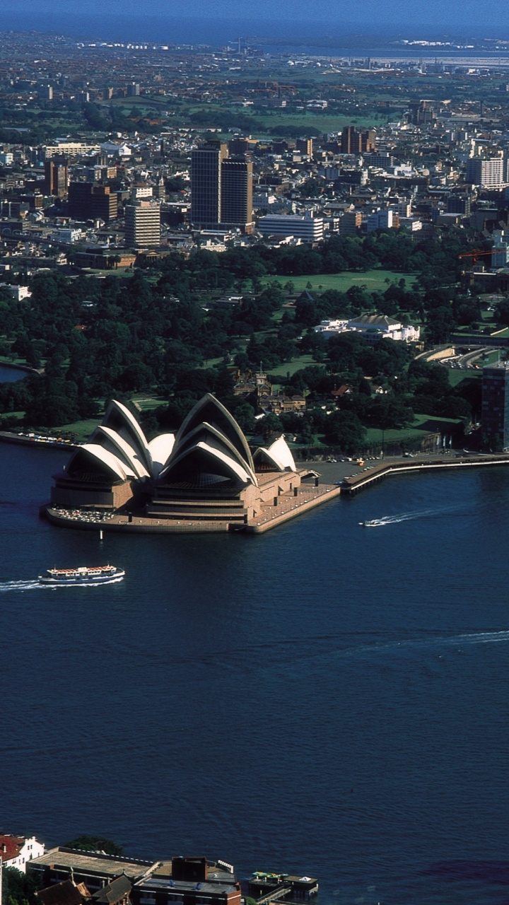 Vista Aérea de Los Edificios de la Ciudad Durante la Noche.. Wallpaper in 720x1280 Resolution