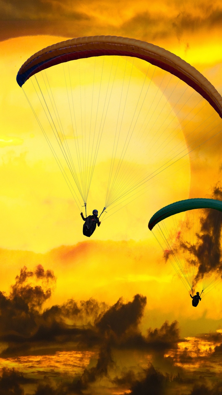 Silhouette of Person Riding Parachute During Sunset. Wallpaper in 720x1280 Resolution