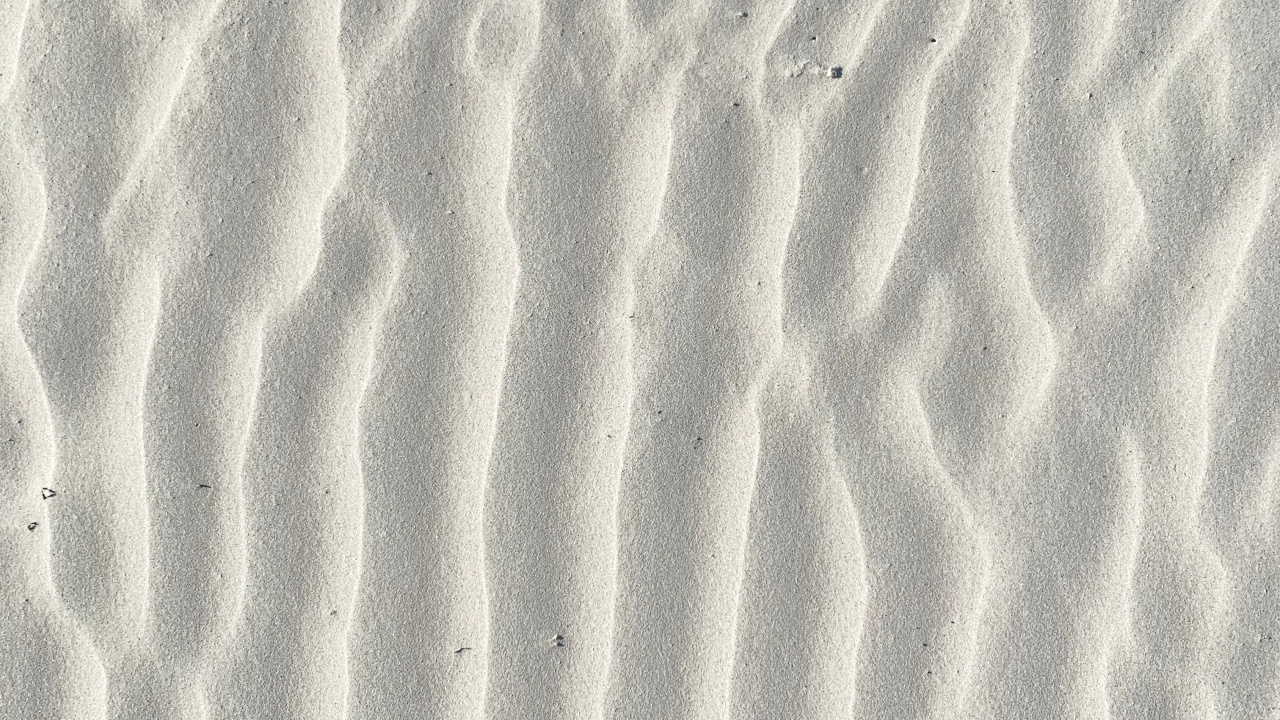 Brown Sand With Footprints During Daytime. Wallpaper in 1280x720 Resolution