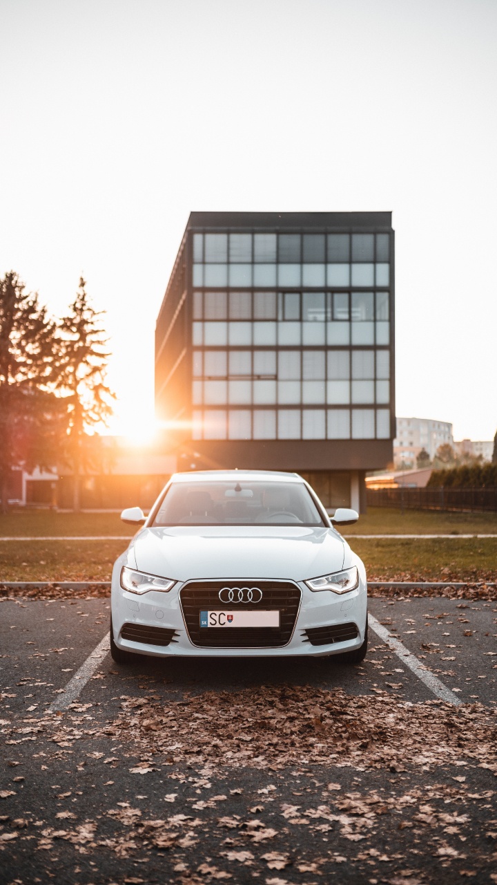 White Audi a 4 Parked on Roadside Near Building During Daytime. Wallpaper in 720x1280 Resolution