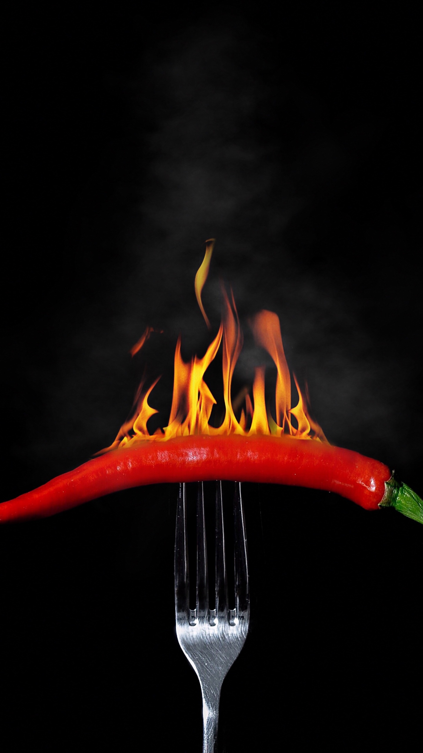 Stainless Steel Fork With Red Chili. Wallpaper in 1440x2560 Resolution