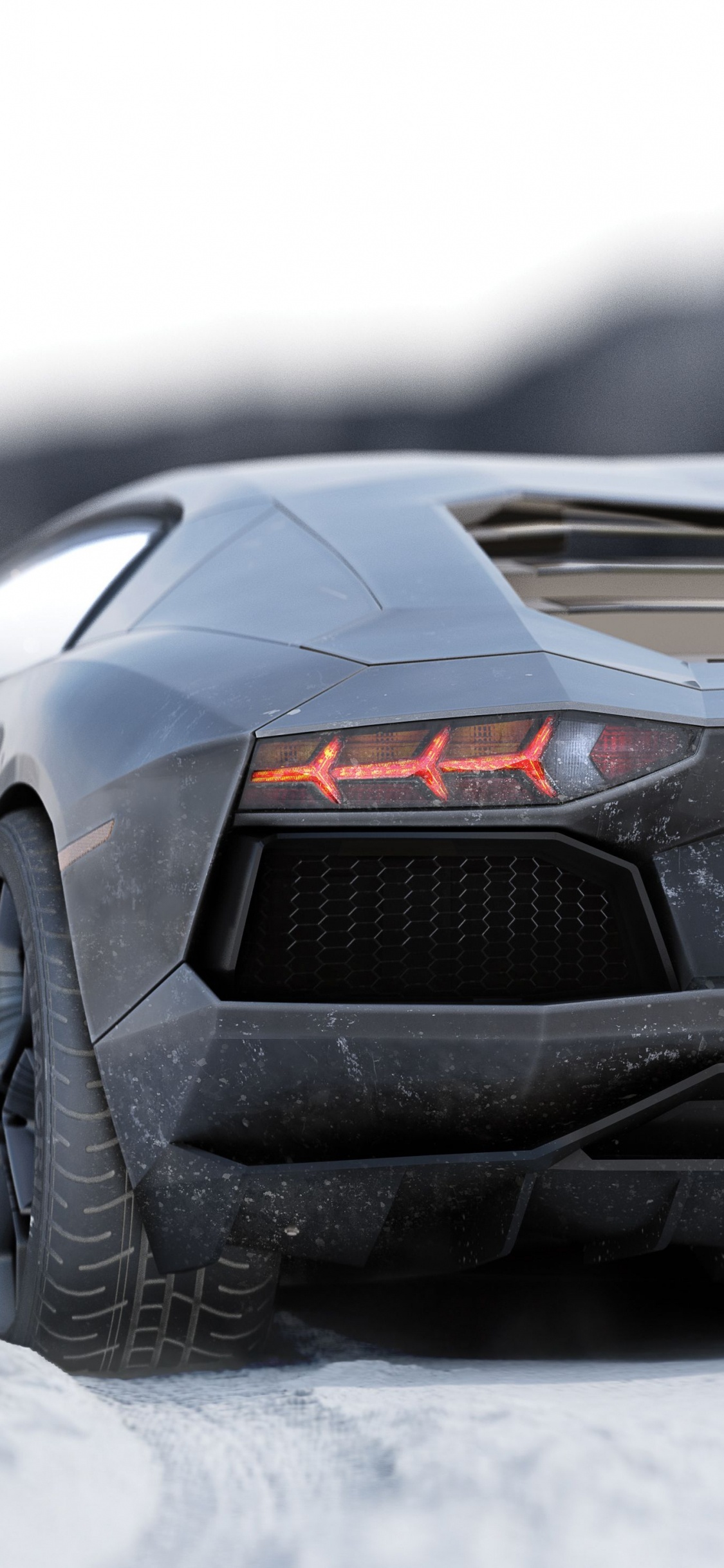 Lamborghini Aventador Noir Sur Sol Couvert de Neige. Wallpaper in 1125x2436 Resolution