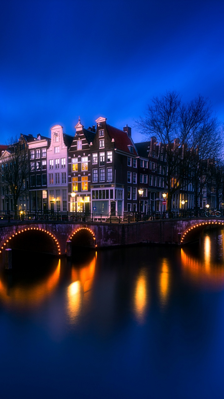 Bridge Over River During Night Time. Wallpaper in 720x1280 Resolution