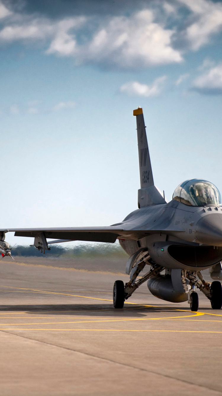Gray Fighter Jet on Gray Concrete Ground Under Blue and White Sunny Cloudy Sky During Daytime. Wallpaper in 750x1334 Resolution