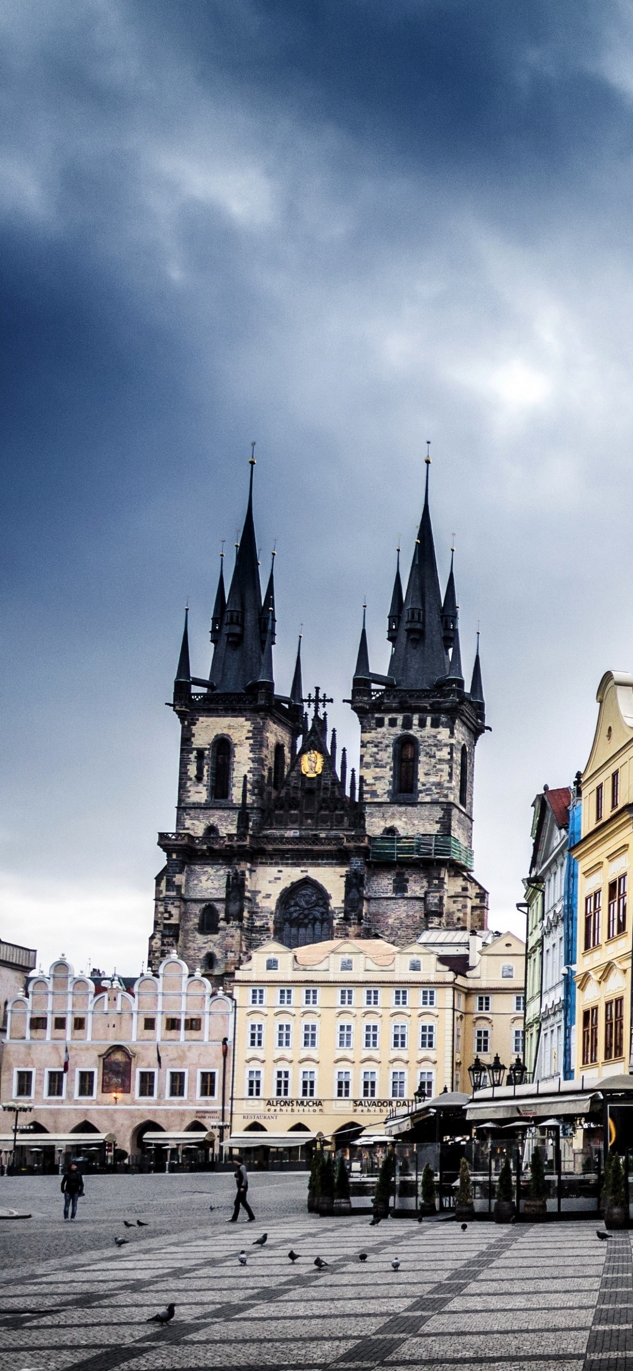 People Walking on Street Near Brown and White Concrete Building During Daytime. Wallpaper in 1242x2688 Resolution