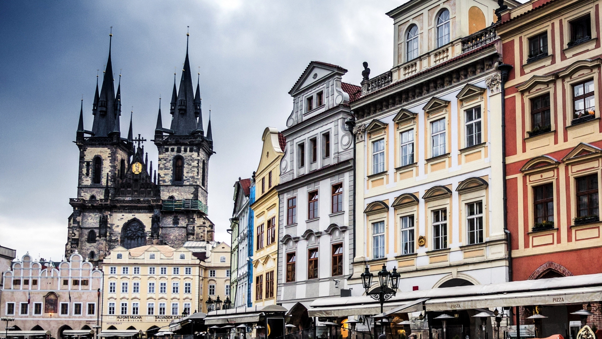 People Walking on Street Near Brown and White Concrete Building During Daytime. Wallpaper in 1920x1080 Resolution