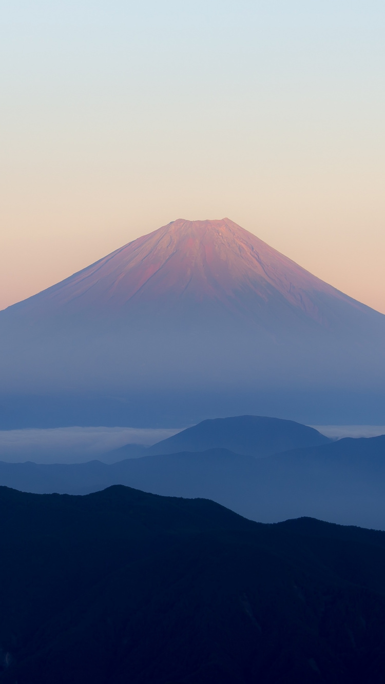 Mountain Ranges Covered in Clouds During Daytime. Wallpaper in 750x1334 Resolution