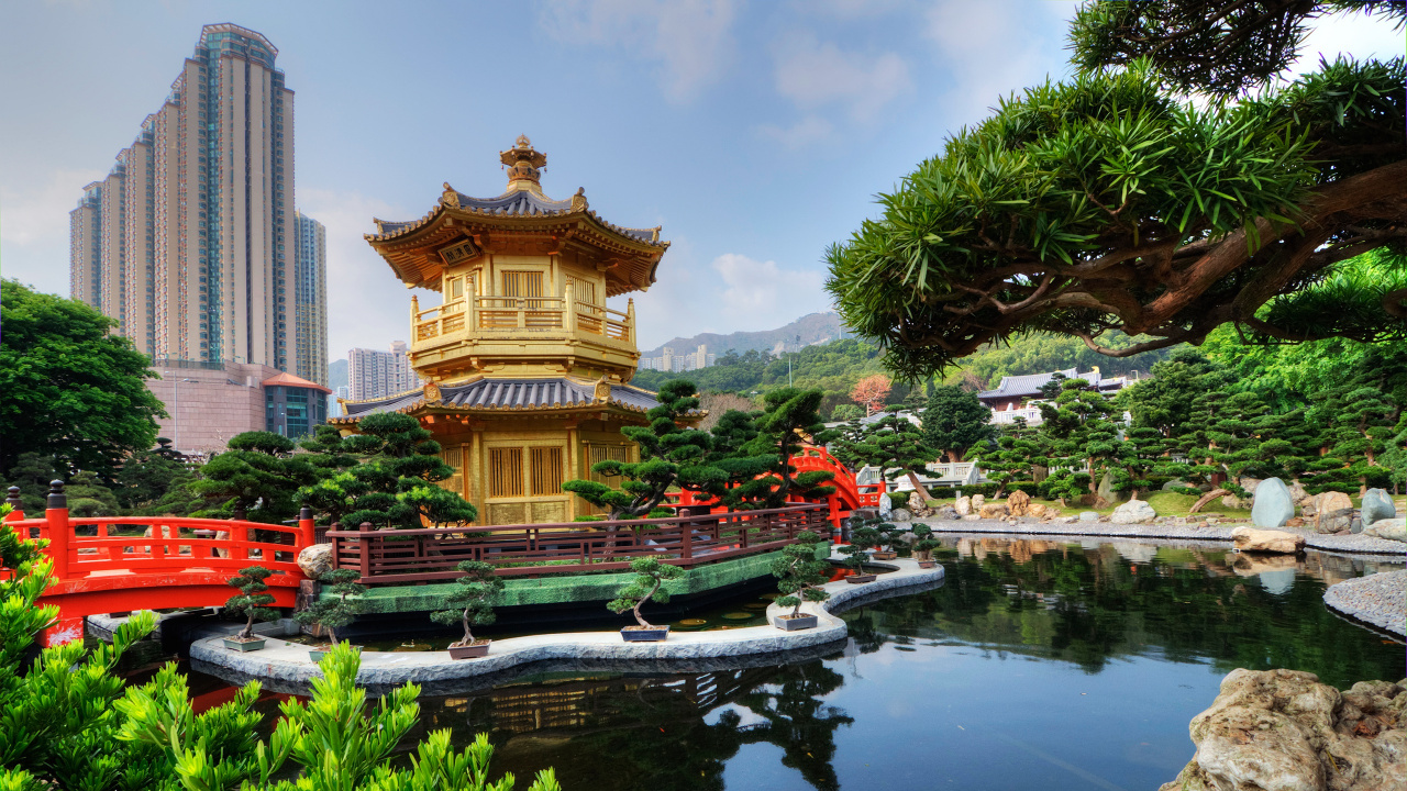 Brown and Beige Temple Near Body of Water During Daytime. Wallpaper in 1280x720 Resolution