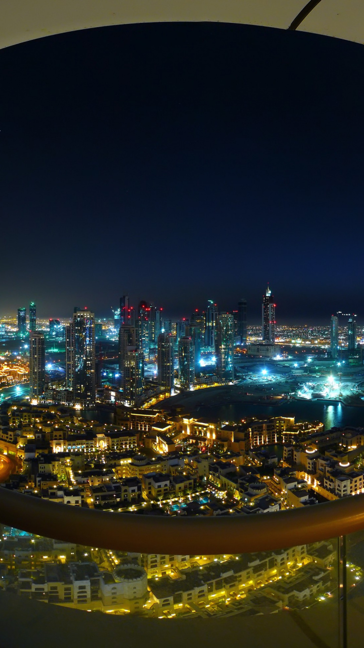 Vue Aérienne Des Bâtiments de la Ville Pendant la Nuit. Wallpaper in 750x1334 Resolution