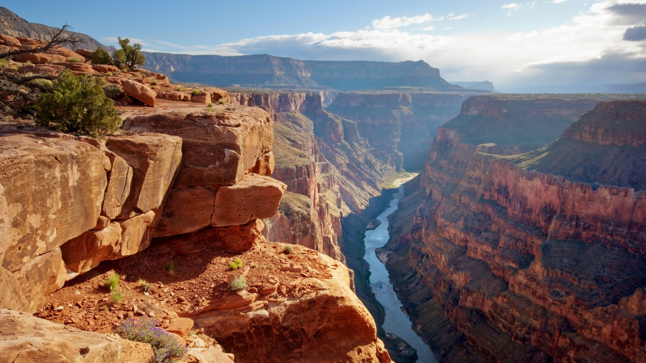 Brown Rocky Mountain With River in The Middle. Wallpaper in 1280x720 Resolution