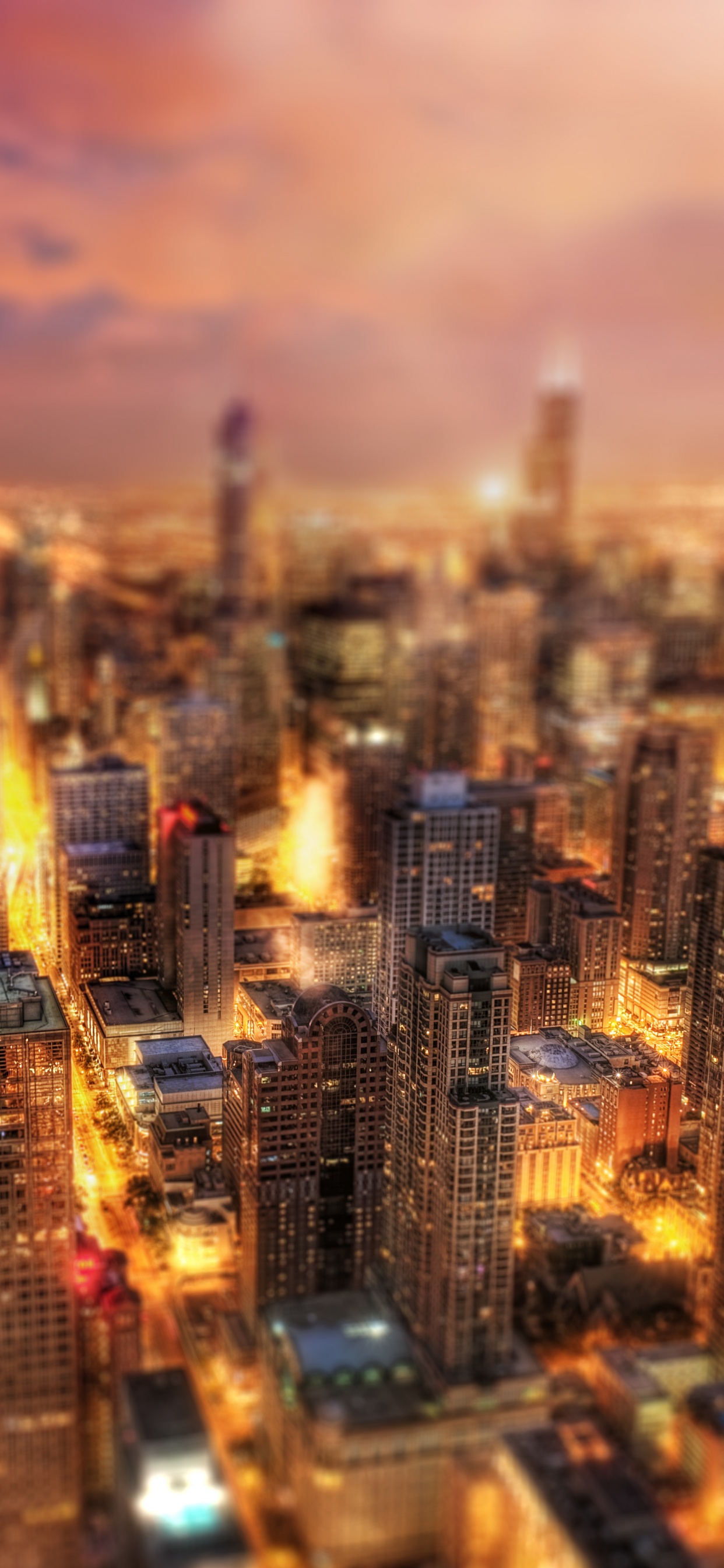 Vista Aérea de Los Edificios de la Ciudad Durante la Noche.. Wallpaper in 1242x2688 Resolution