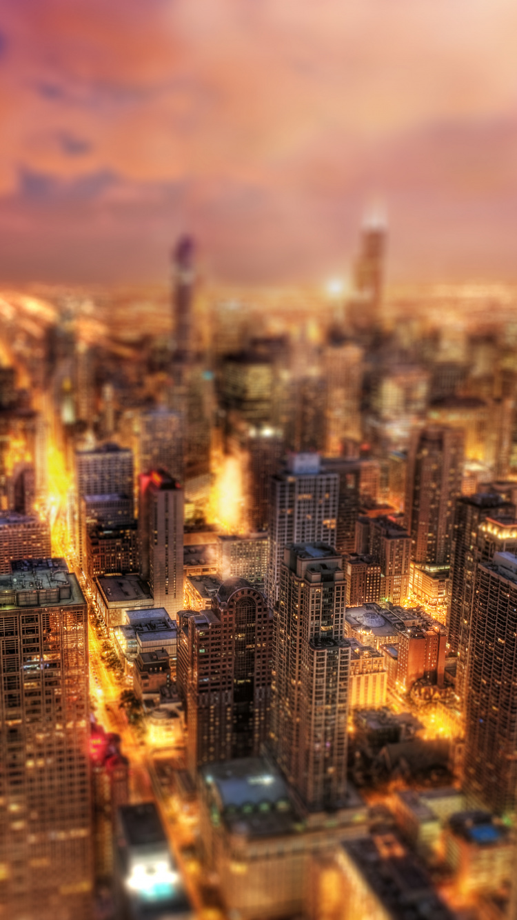 Luftaufnahme Von Stadtgebäuden Während Der Nacht. Wallpaper in 750x1334 Resolution