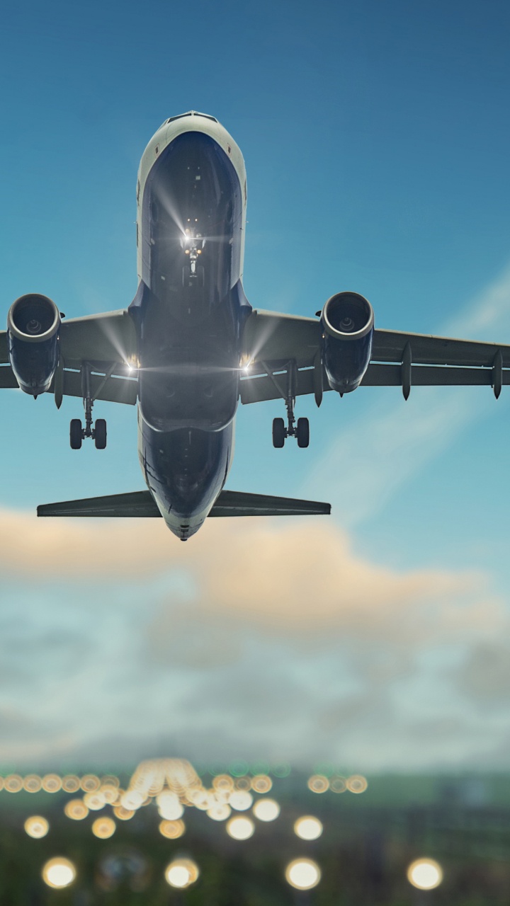 White and Blue Airplane Flying During Daytime. Wallpaper in 720x1280 Resolution