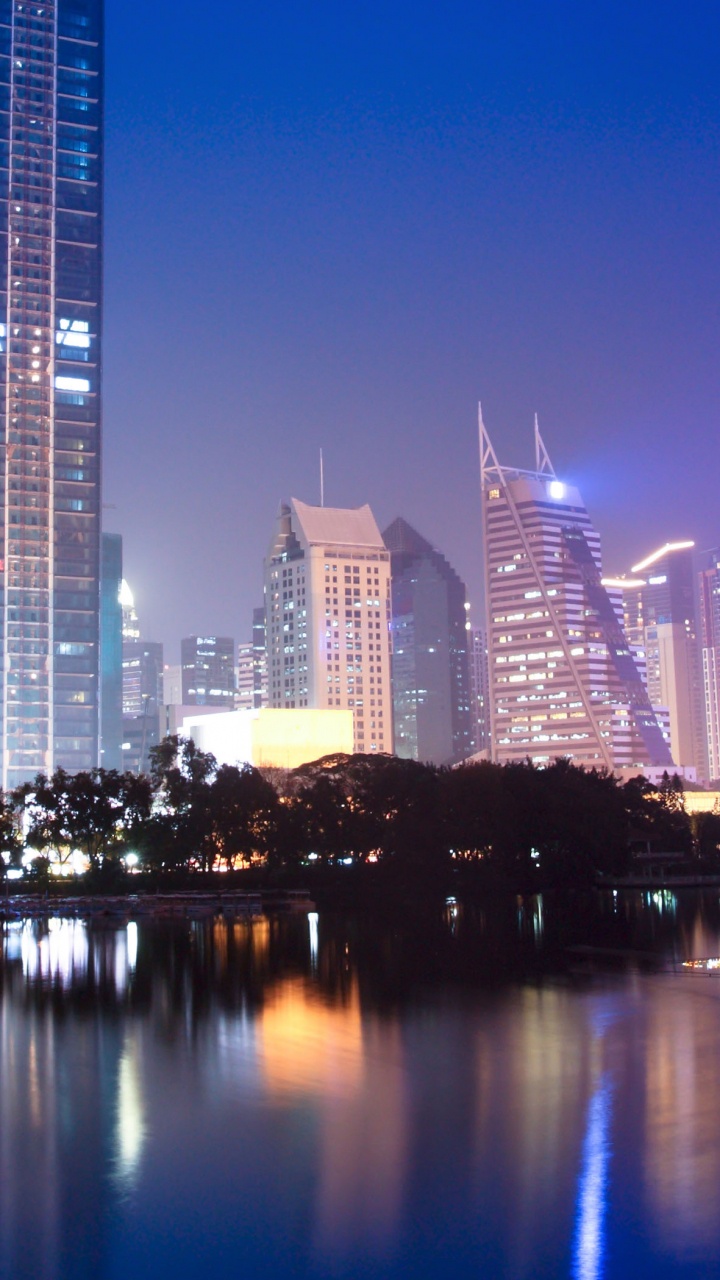 City Skyline During Night Time. Wallpaper in 720x1280 Resolution