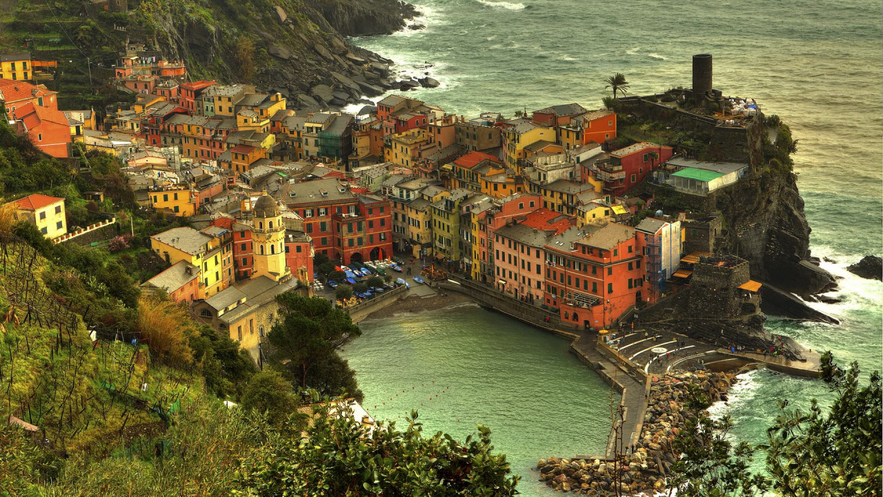 Aerial View of City Buildings Near Body of Water During Daytime. Wallpaper in 1280x720 Resolution