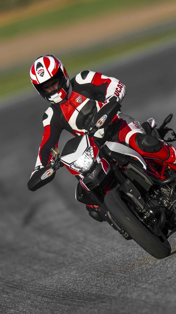 Man in Red and White Racing Suit Riding on Black and Red Sports Bike. Wallpaper in 720x1280 Resolution