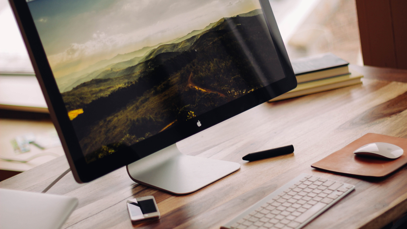 Download 1366x768 Wallpaper Silver Imac on Brown Wooden Table Silver Imac on Brown Wooden Table. Wallpaper in 1366x768 Resolution