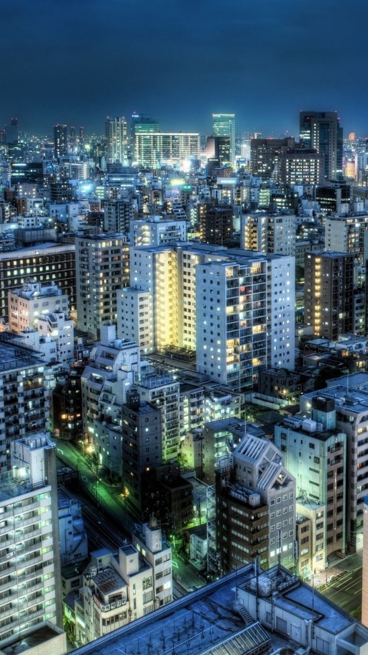 City Skyline During Night Time. Wallpaper in 720x1280 Resolution