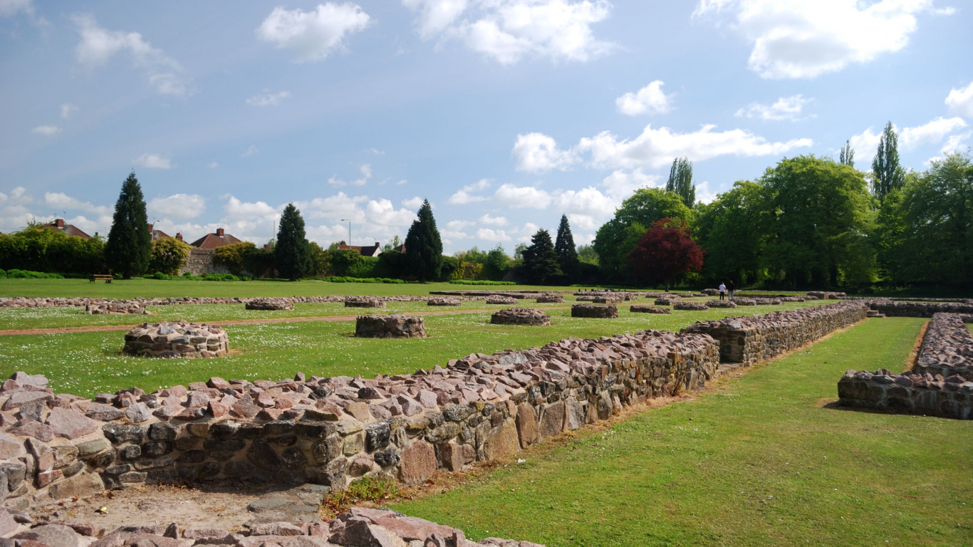 Green Grass Field With Rocks and Trees Under Blue Sky During Daytime. Wallpaper in 1366x768 Resolution
