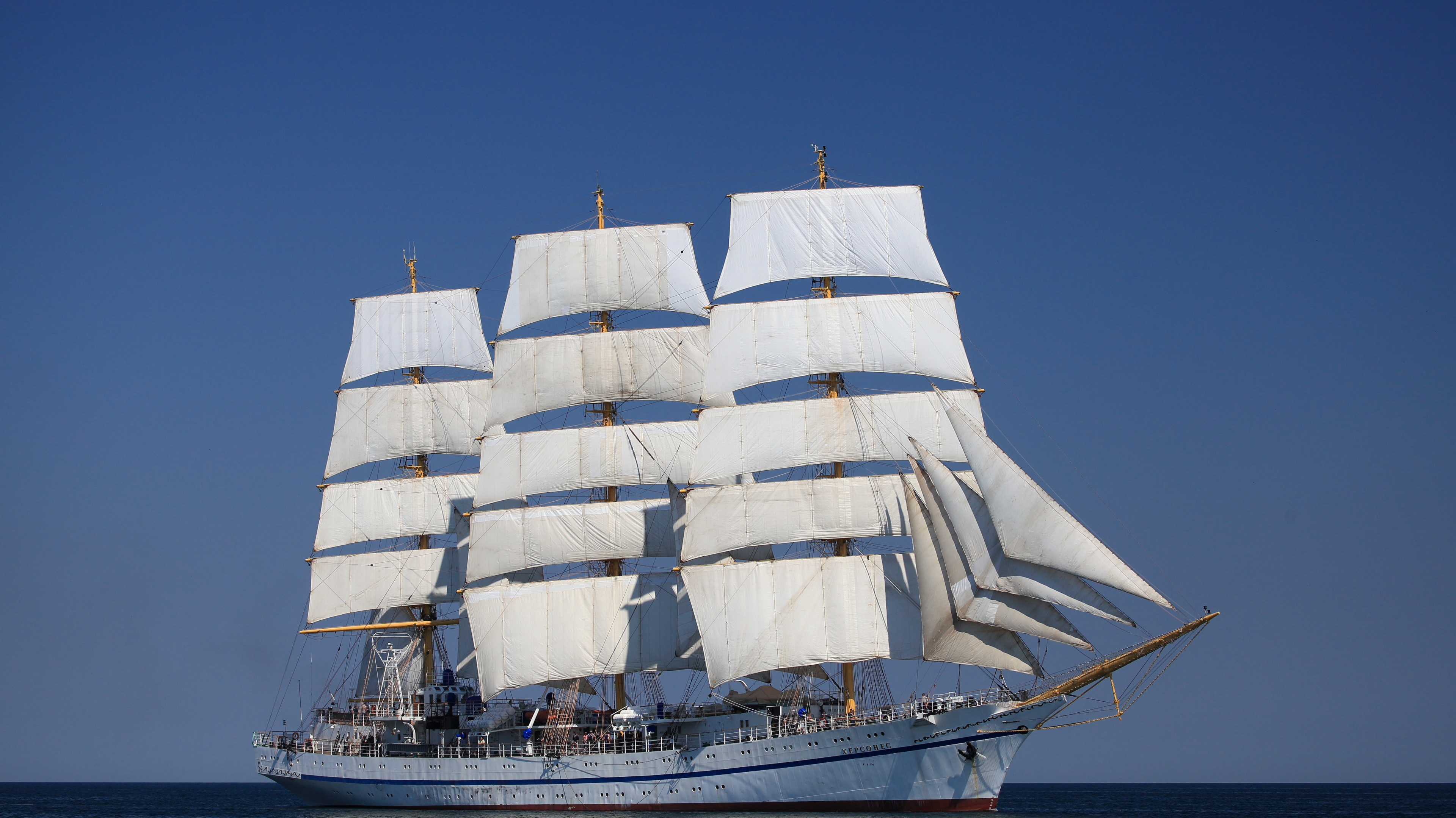 White Sail Boat on Sea Under Blue Sky During Daytime. Wallpaper in 3840x2160 Resolution