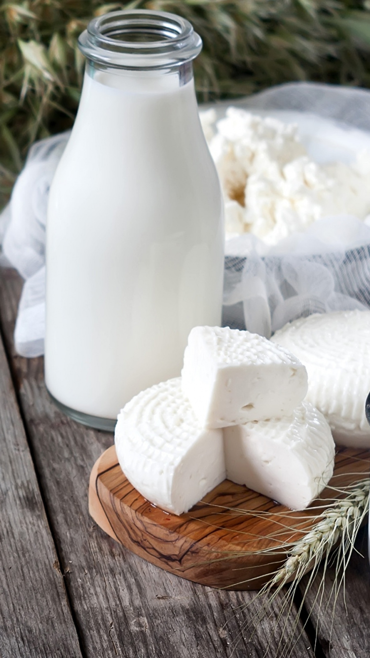 White Ceramic Vase on Brown Wooden Table. Wallpaper in 750x1334 Resolution