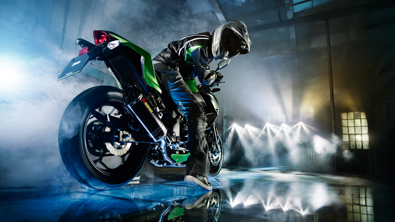 Homme en Costume de Moto Noir et Rouge à Cheval Sur un Vélo de Sport Rouge. Wallpaper in 1366x768 Resolution