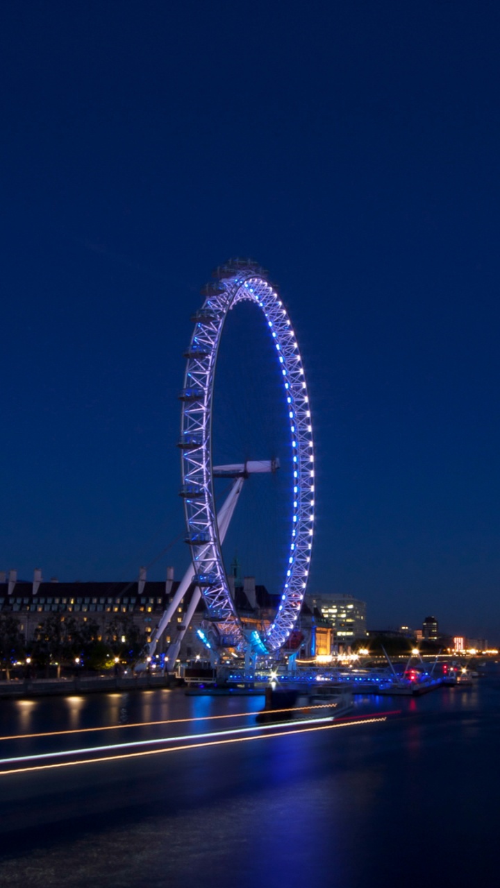 Ferris Wheel Near Body of Water During Night Time. Wallpaper in 720x1280 Resolution