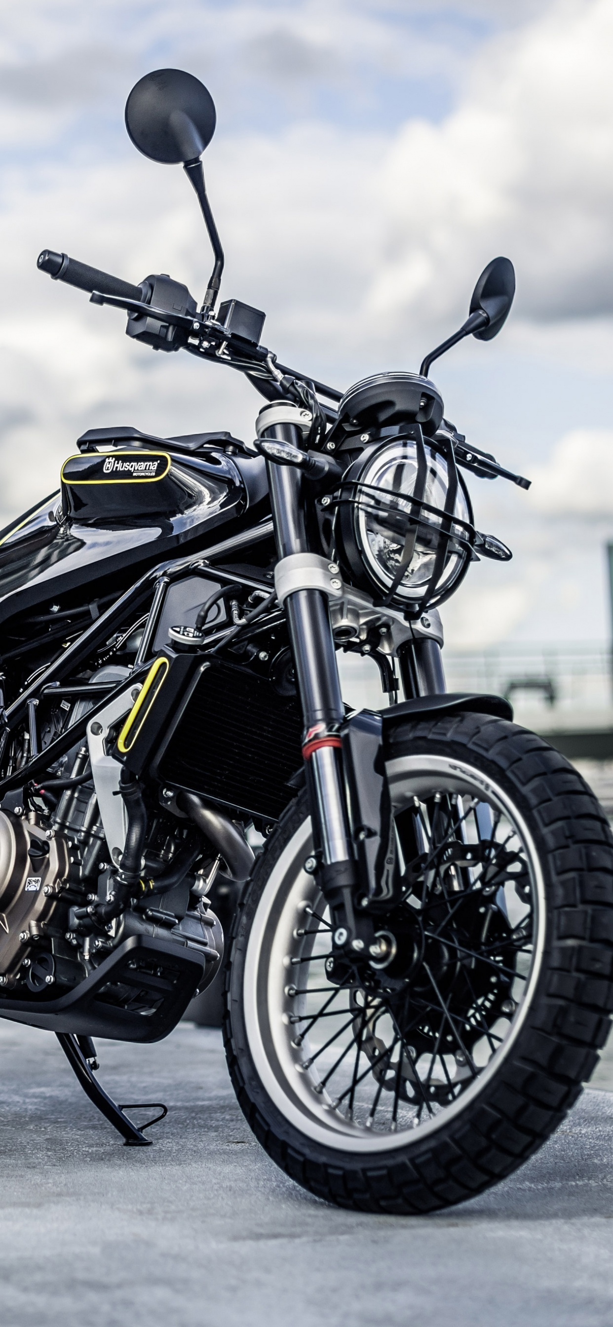 Black and Silver Motorcycle on Gray Concrete Floor. Wallpaper in 1242x2688 Resolution