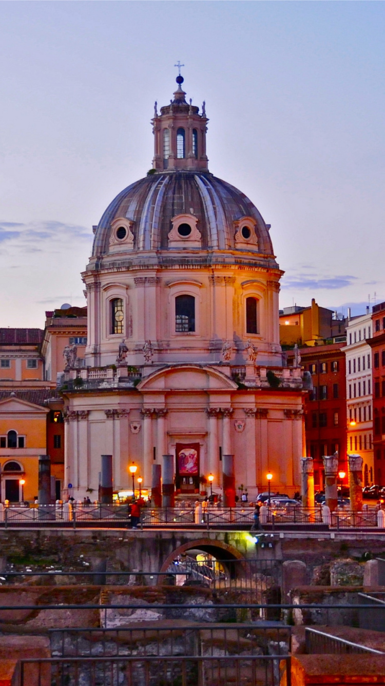 Brown and White Concrete Building During Night Time. Wallpaper in 750x1334 Resolution