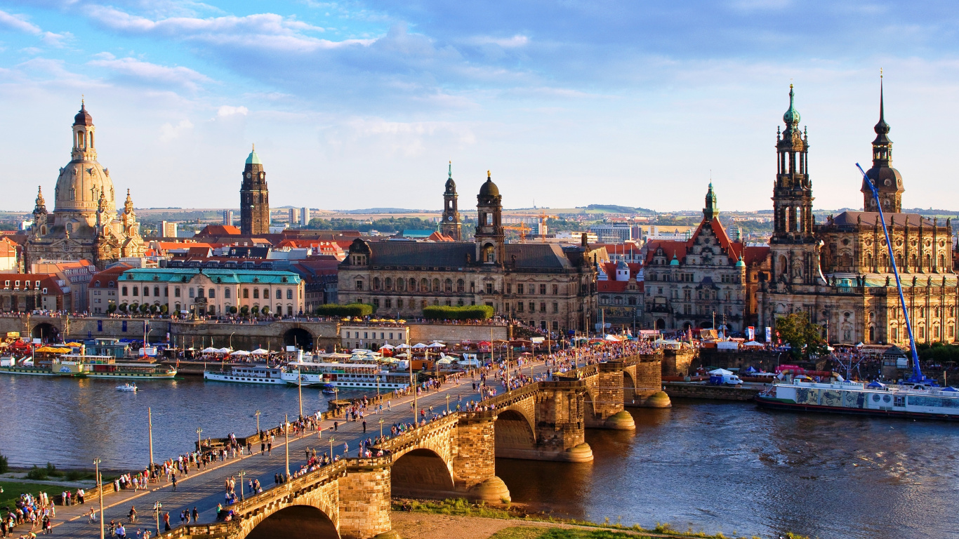 Brown Bridge Over River Near City Buildings During Daytime. Wallpaper in 1366x768 Resolution