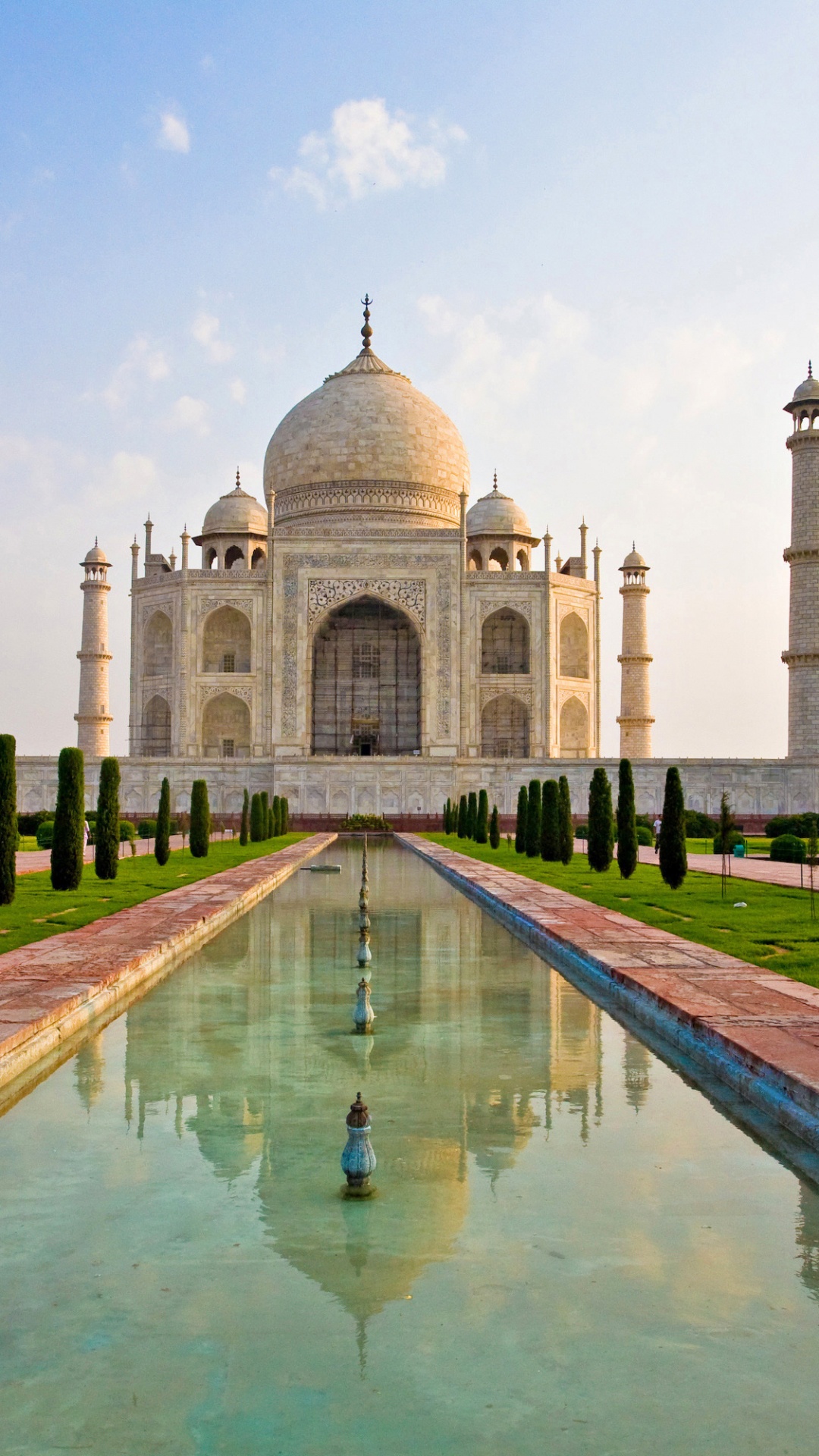 White and Brown Concrete Building Under Blue Sky During Daytime. Wallpaper in 1080x1920 Resolution