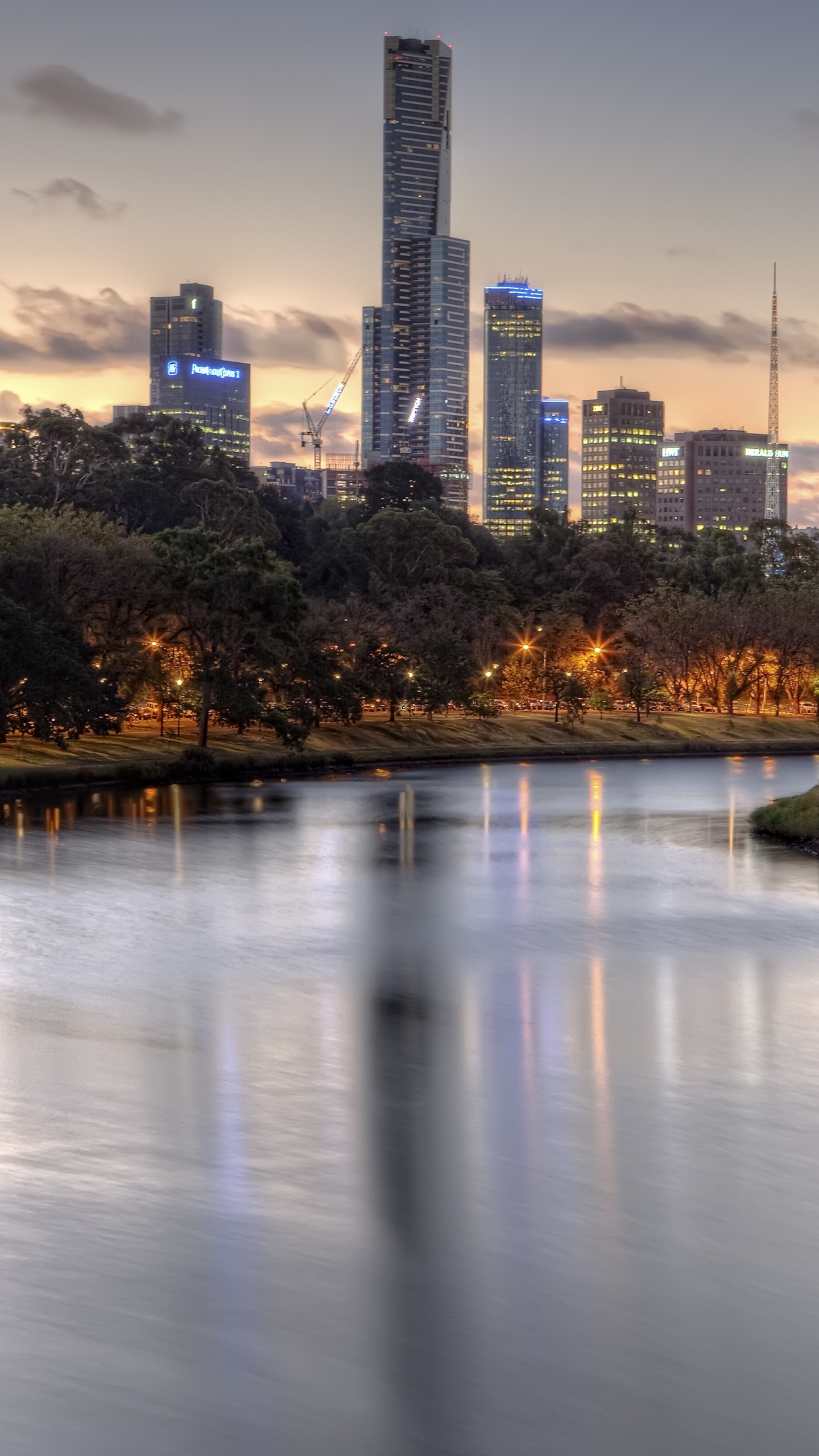 Body of Water Near Trees and Buildings During Daytime. Wallpaper in 1440x2560 Resolution