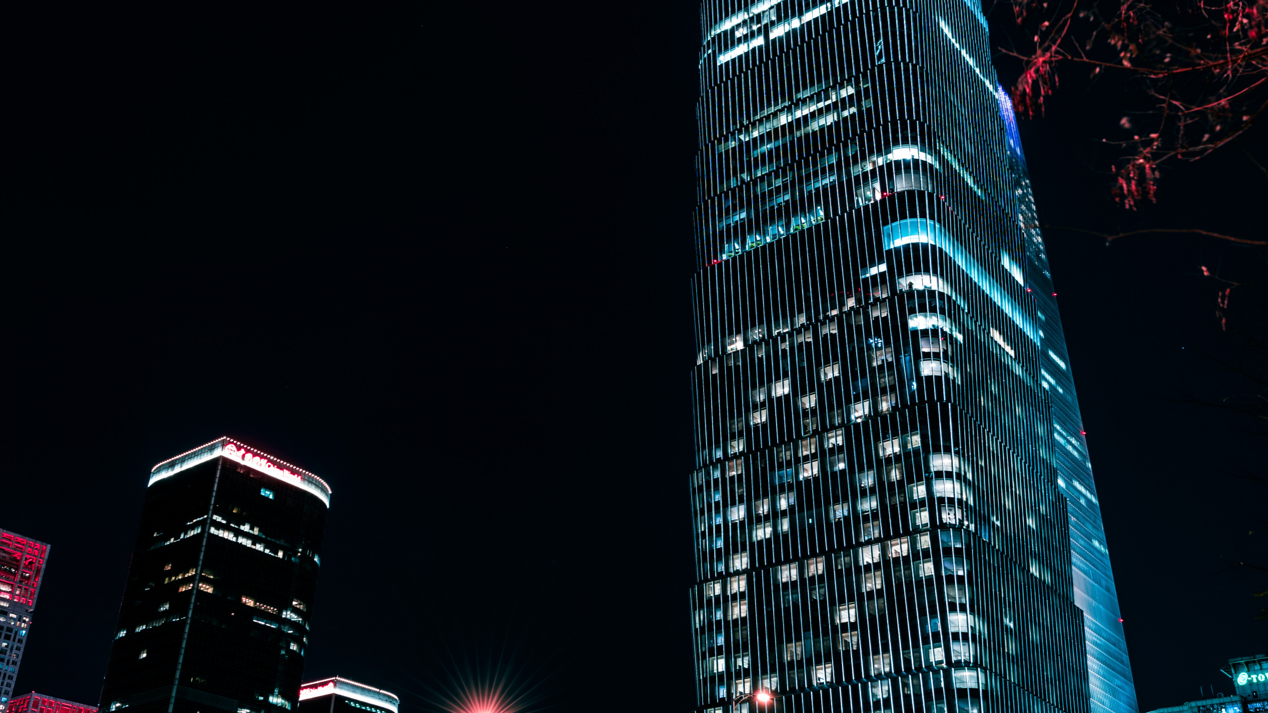 Blue and Black High Rise Building During Night Time. Wallpaper in 2560x1440 Resolution