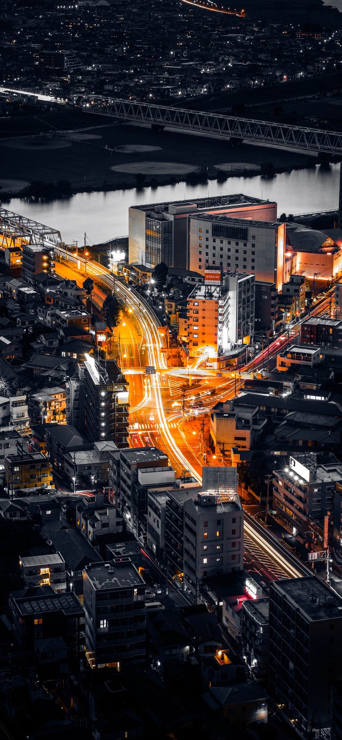 Aerial View of City Buildings During Night Time. Wallpaper in 1125x2436 Resolution