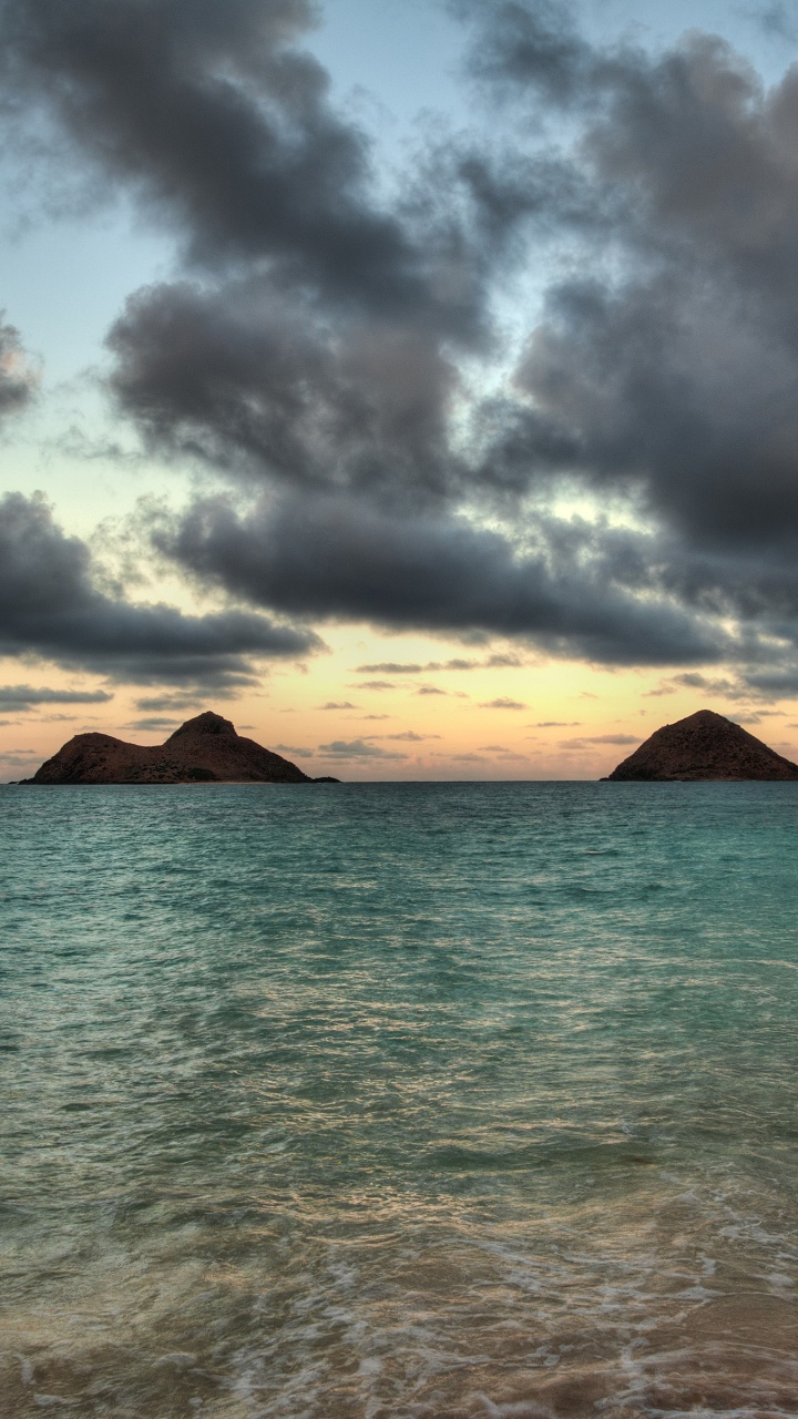 Brown Mountain Near Body of Water Under Cloudy Sky During Daytime. Wallpaper in 720x1280 Resolution